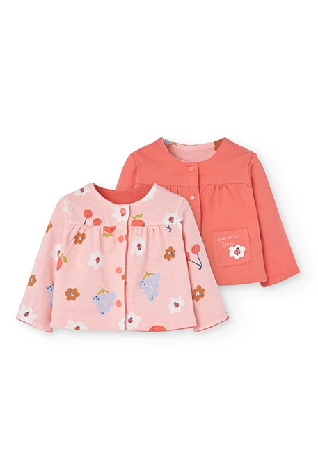 Veste en maille réversible pour bébé fille en rouge et rose.