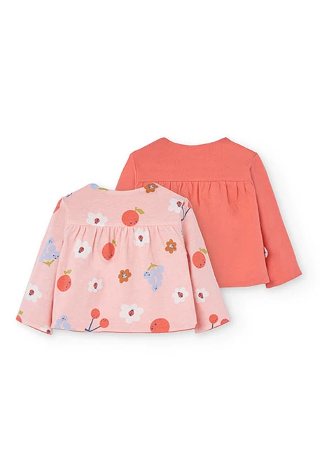 Veste en maille réversible pour bébé fille en rouge et rose.