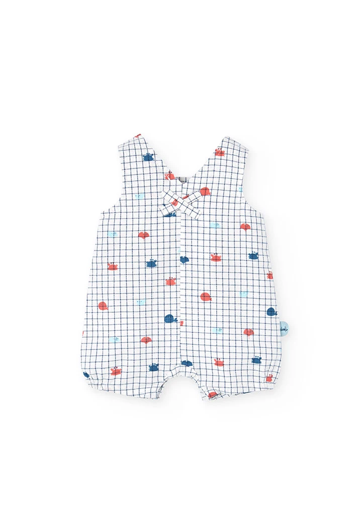 Salopette in popeline per bambino in colore bianco con stampa a quadri in blu e rosso.