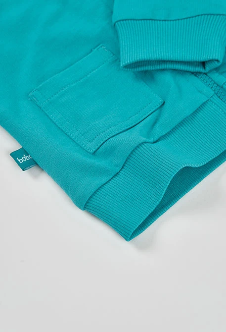 Babykapuzenjacke aus grünem Frottee.