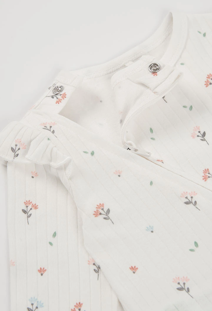 Pelele bebé crudo estampado flores con volantes