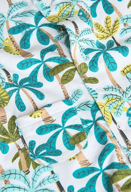 Barboteuse en tricot pour bébé garçon en bleu et vert avec imprimé de palmiers.