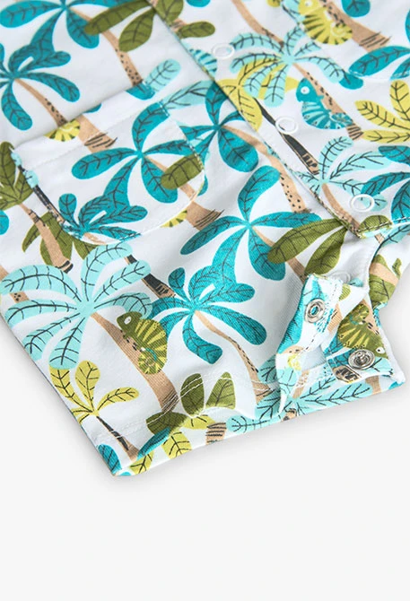 Barboteuse en tricot pour bébé garçon en bleu et vert avec imprimé de palmiers.