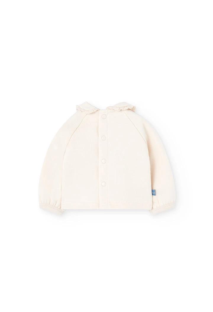 Ensemble bébé en tricot écru avec fleurs
