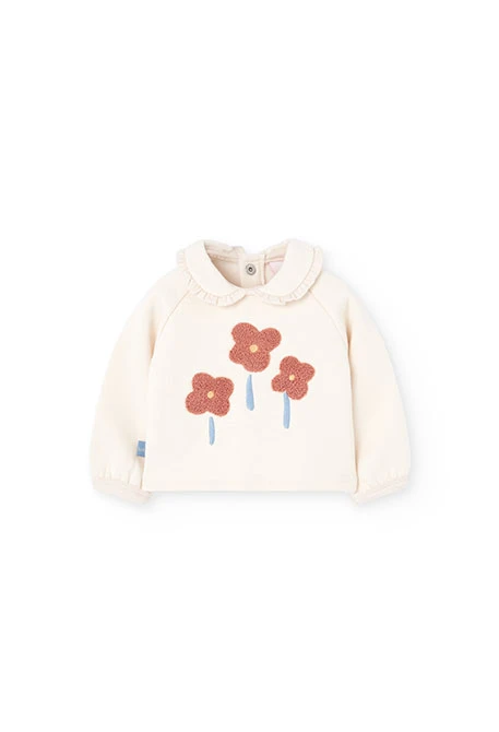 Ensemble bébé en tricot écru avec fleurs