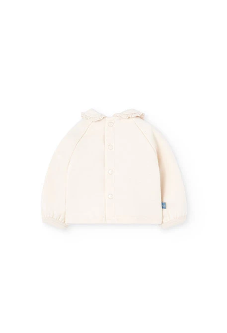 Ensemble bébé en tricot écru avec fleurs
