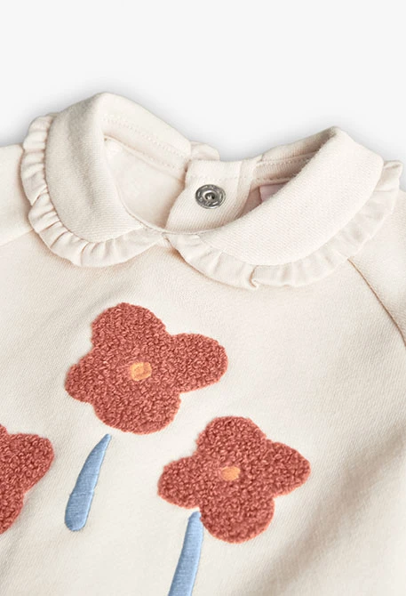 Ensemble bébé en tricot écru avec fleurs