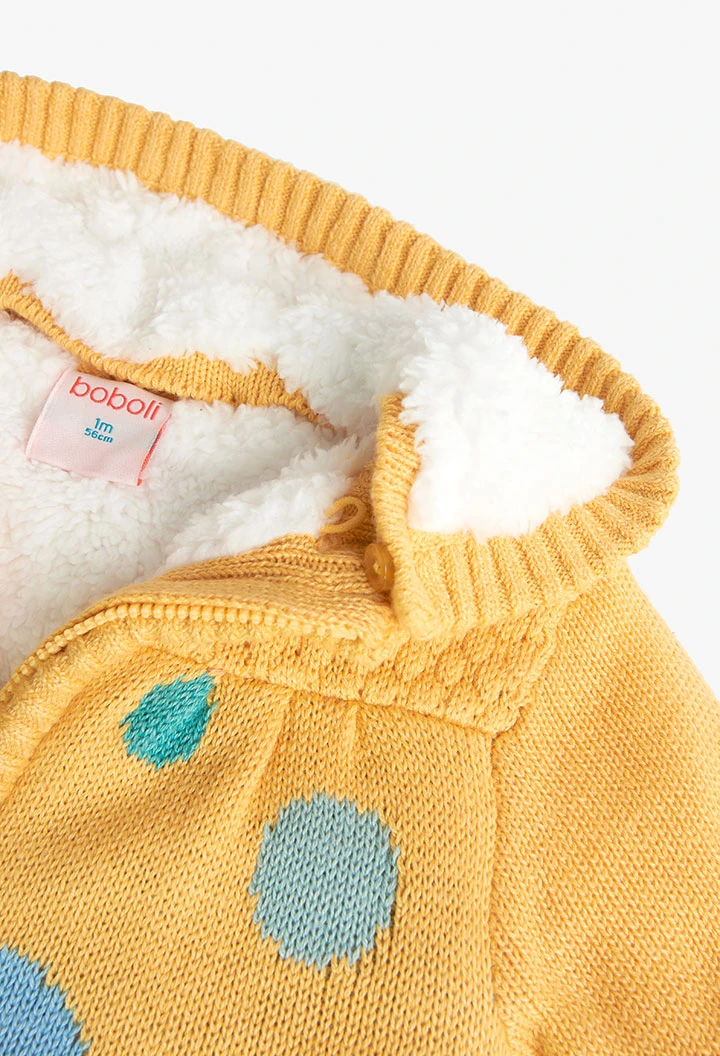 Knitted jacket for baby girl in yellow colour