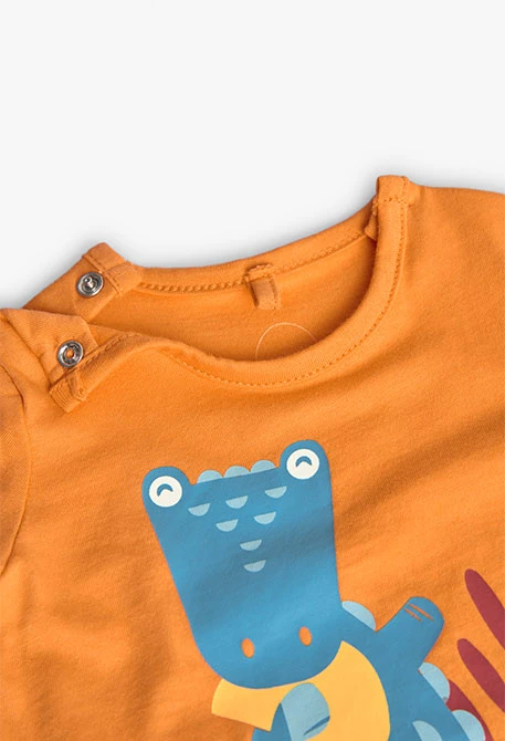 Knitted romper for baby boy in orange colour