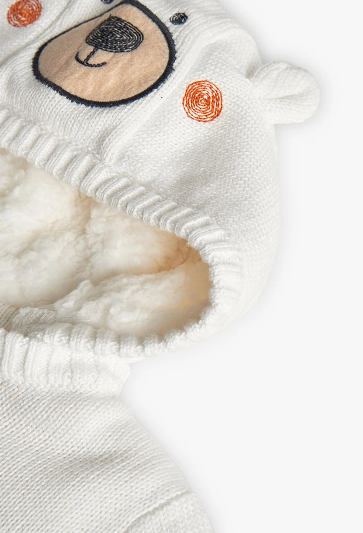 Knitted baby jacket in white