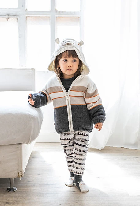 Knitted baby jacket in white