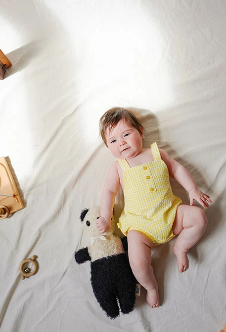 Baby girl\'s poplin romper in yellow check pattern