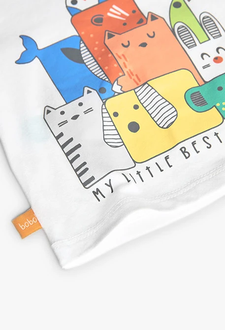 Set di maglietta e pantaloni in maglia per neonato di colore bianco.