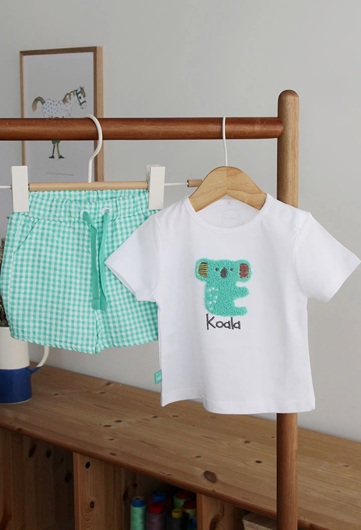 Nursery set with a koala design in white for baby boys.