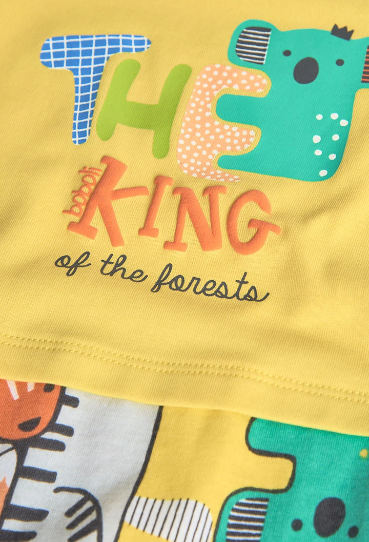 Knitted short romper for baby boy in yellow.