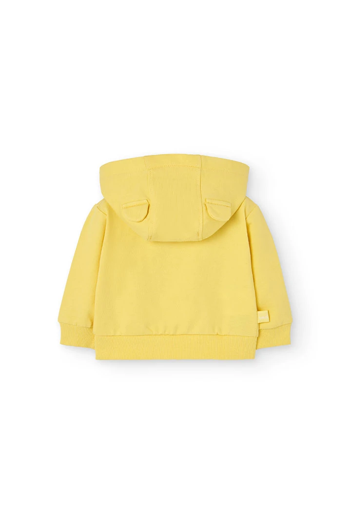 Cardigan per neonato di colore giallo.