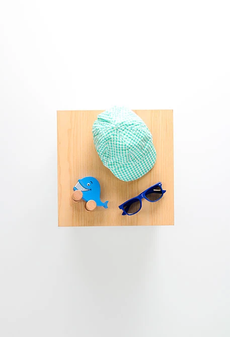 Cappellino in popeline per bebè a quadri verdi