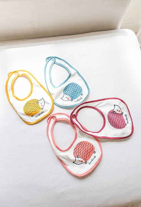 White baby bibs with animals