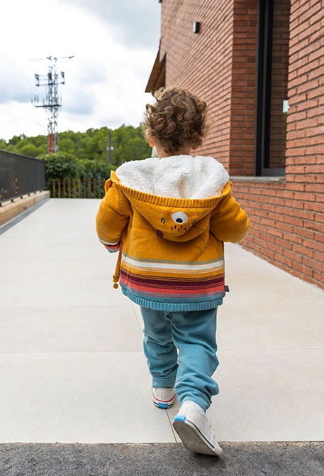 Yellow baby jacket with stripes