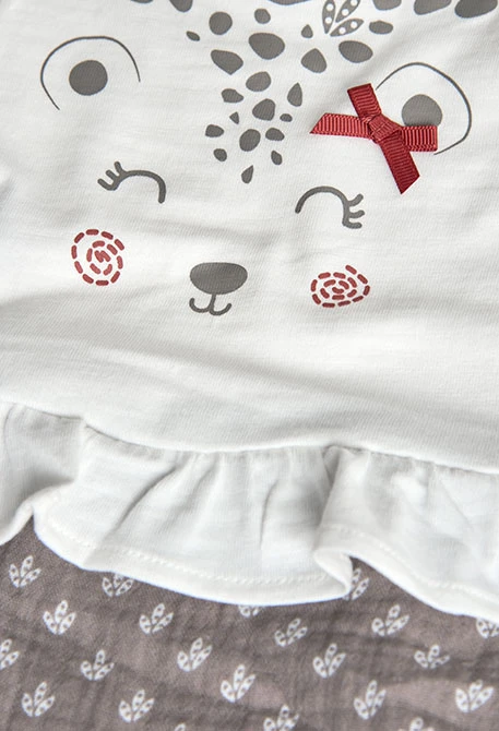 Tutina in maglia per neonata in bianco combinato