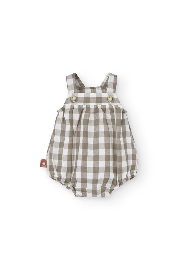 Tutina in maglia per bebé a quadri nei toni della terra.