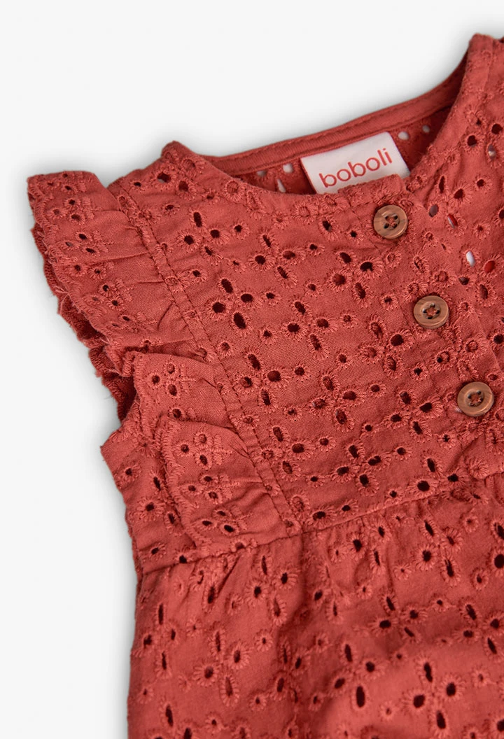 Tutina a maglia per bambina in colore arancione ricamata