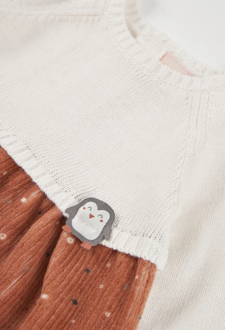 White knitted dress combined with penguin