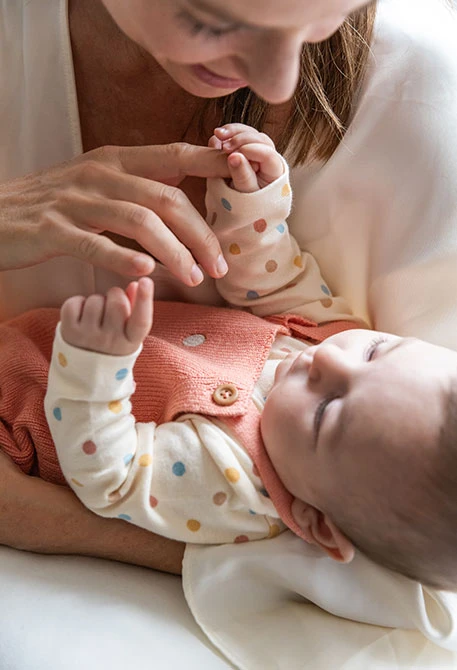Baby bodysuit with polka dots