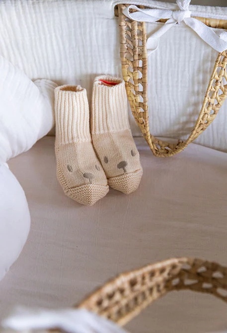 Knitted baby booties hedgehogs