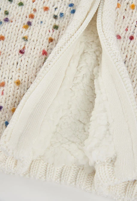 Strickjacke für Babymädchen in Weiß mit farbigen Punkten