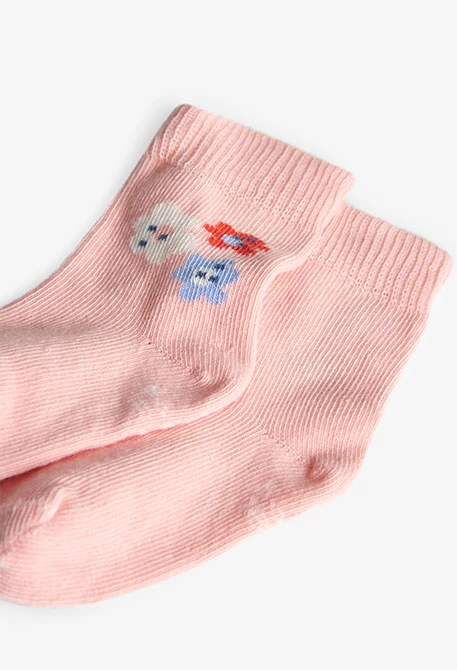 Pack of knitted baby socks in pink.