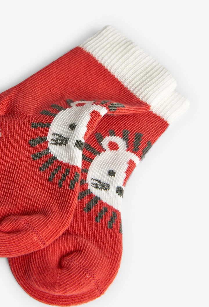 Confezione di calzini a maglia per bambino in colore arancione.