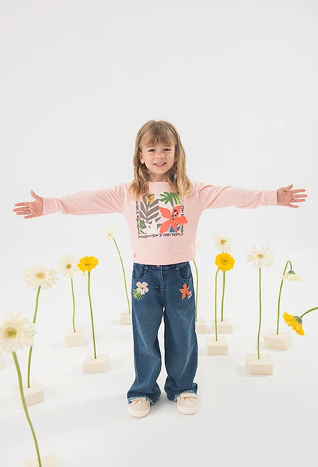 Pantaloni in maglia per neonata in colore blu con ricamo