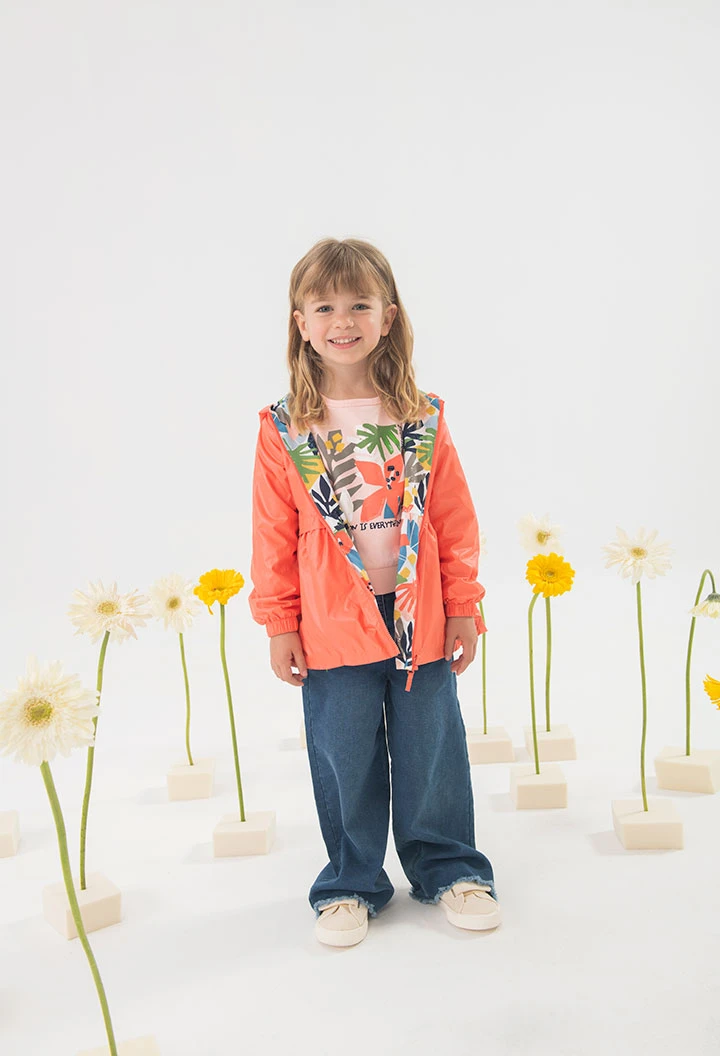 Parka reversibile per bambina in colore rosso.