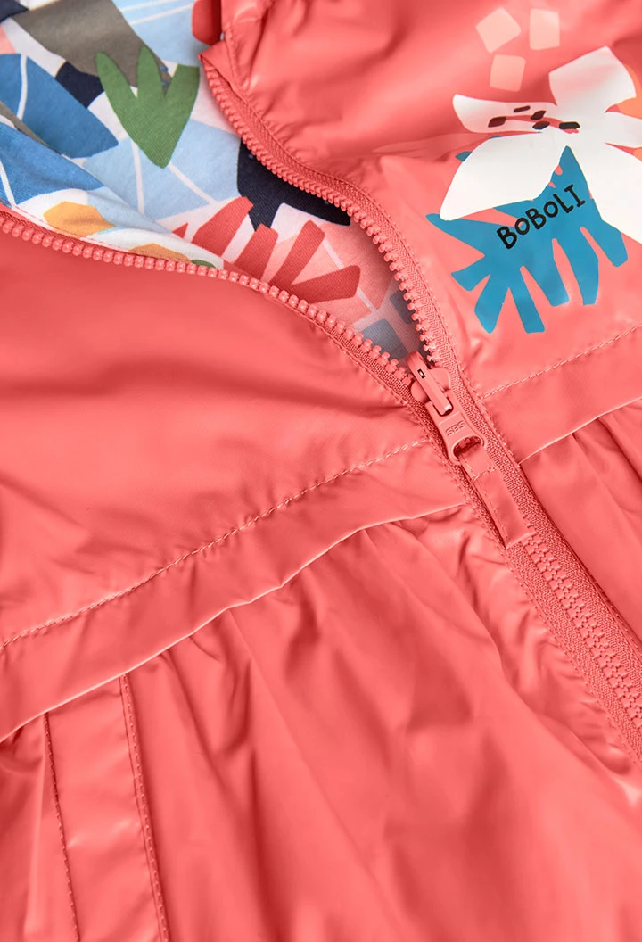 Parka reversibile per bambina in colore rosso.