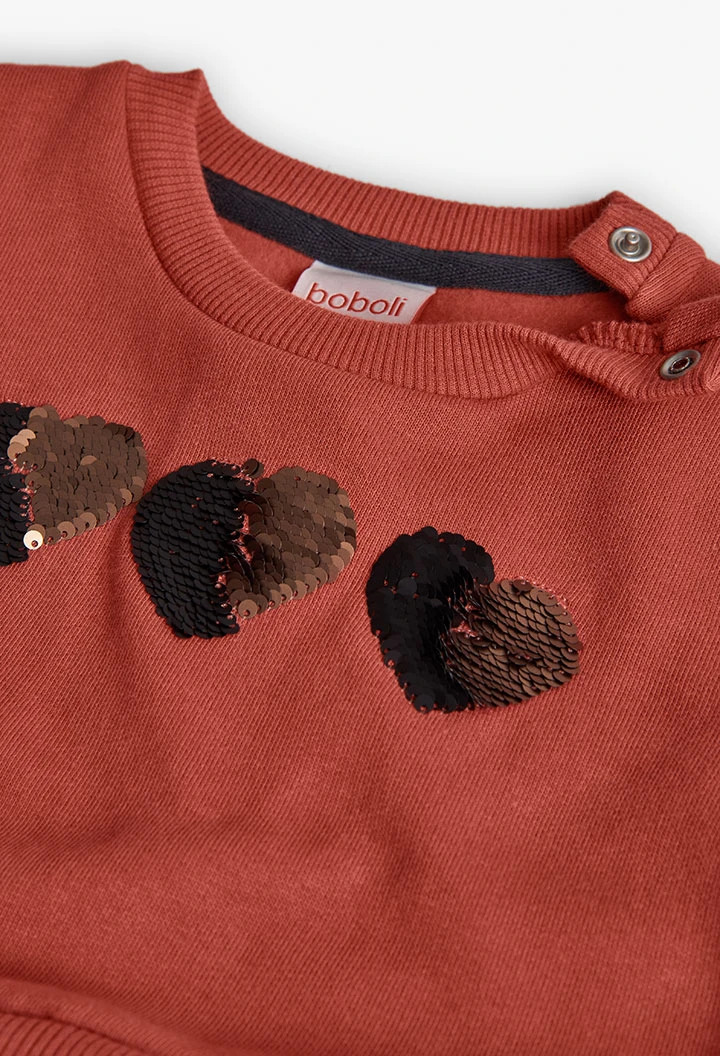 Orangenfarbenes Kleid mit Herzen