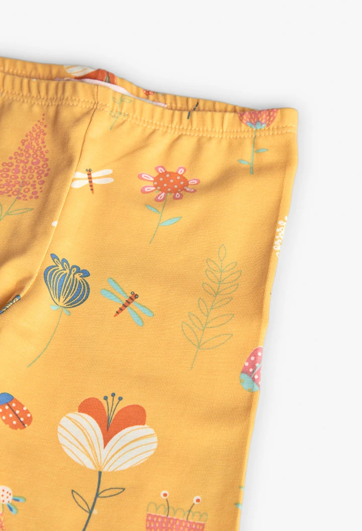 Knitted leggings for baby girl in yellow with print