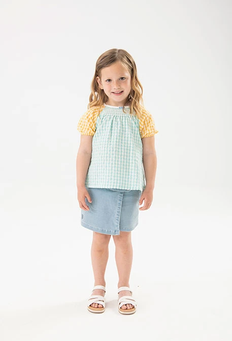 Blouse en popeline pour bébé fille avec motif à carreaux multicolores.