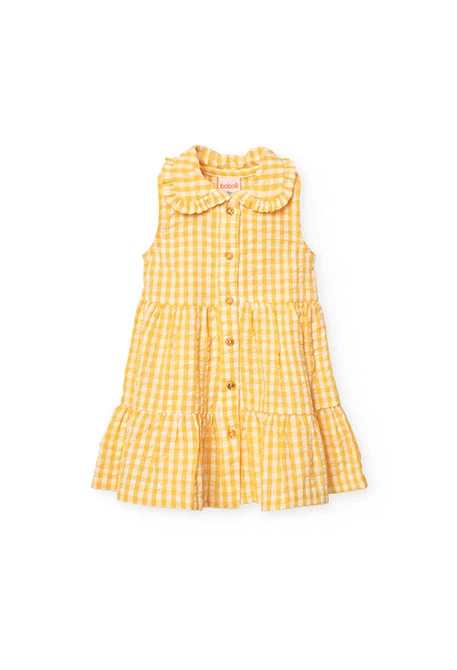 Baby girl\'s poplin dress with a yellow check pattern.