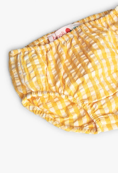 Baby girl\'s poplin dress with a yellow check pattern.