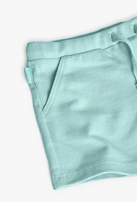 Conjunt de samarreta i pantalons curts de punt per a nadó nena de color blanc.