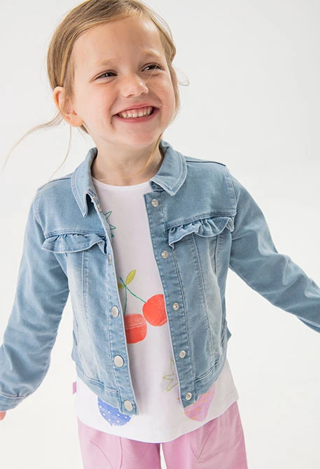 Baby girl's knitted jacket in bleach colour