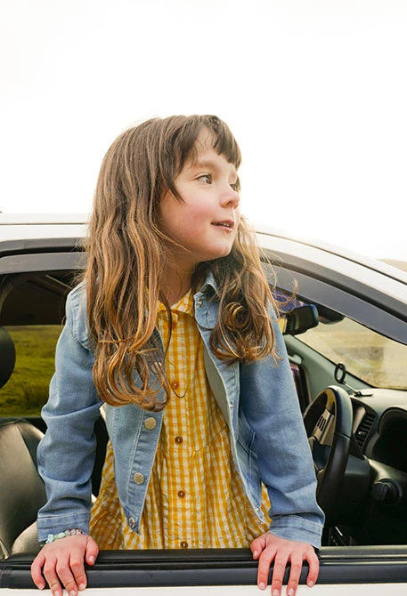 Baby girl's knitted jacket in bleach colour