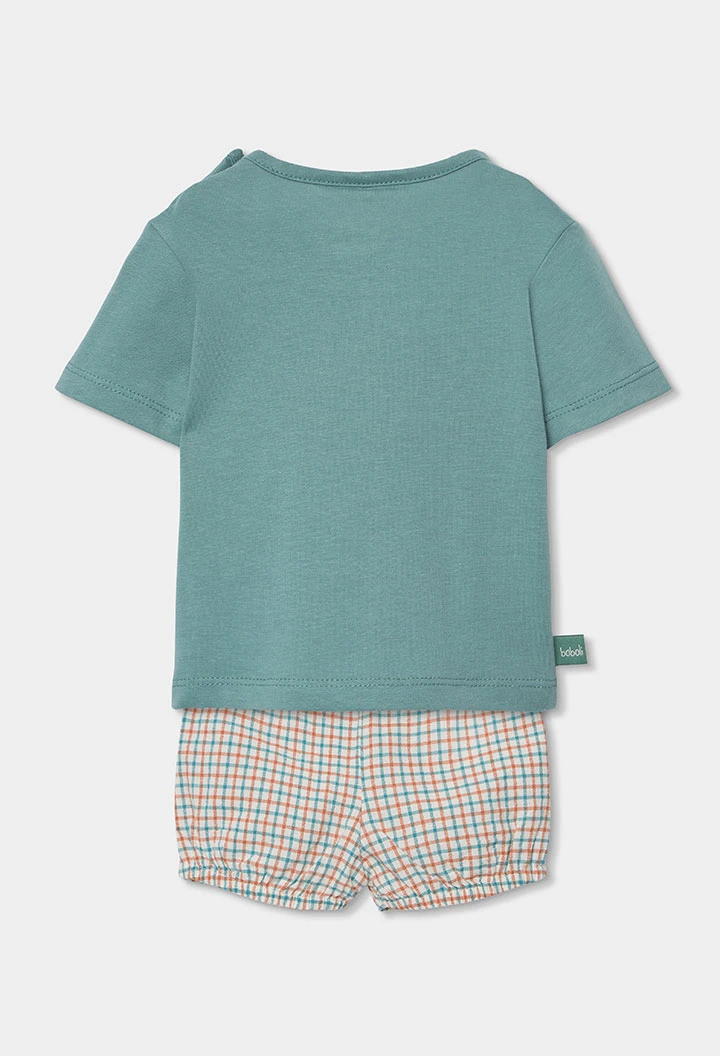 Baby-Set mit T-Shirt und kurzer Hose aus grünem Baumwolle.