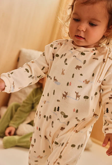 Pagliaccetto in velluto neonato écru stampa foresta
