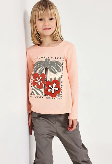 Maglietta a maglia per bambina in colore salmone