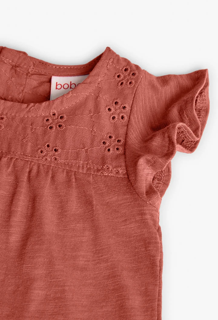 T-shirt en tricot pour bébé fille de couleur orange.