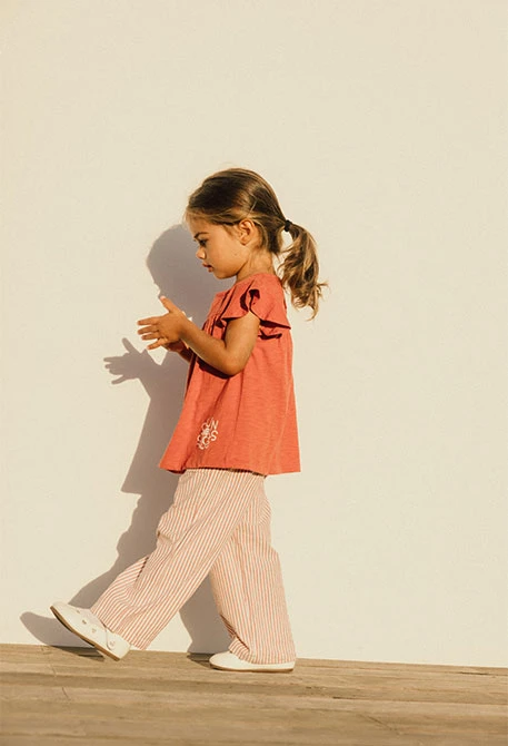Pantalone in popeline per bambino a righe arancioni e bianche