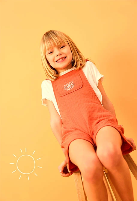 Mono de punto para bebé niña en color naranja