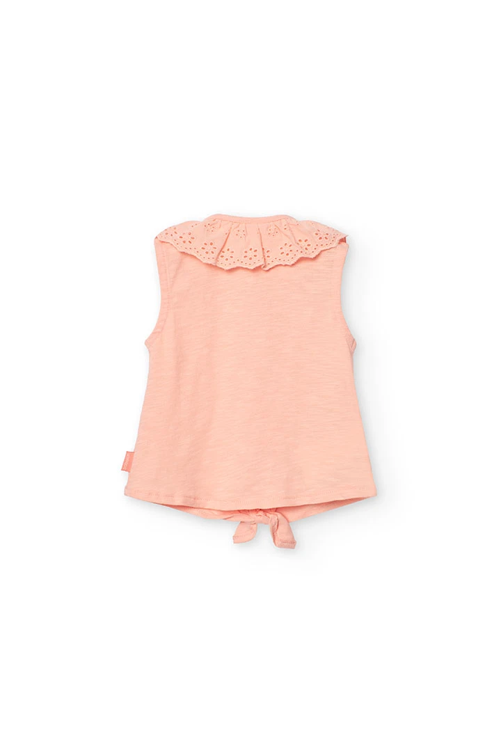 T-shirt en maille pour bébé fille de couleur saumon avec détail en dentelle.